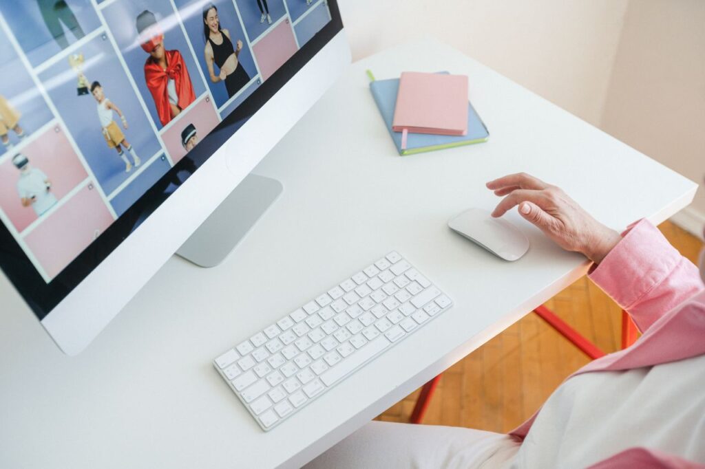 Bright and modern workspace setup with a desktop computer, mouse, and keyboard on a white desk.